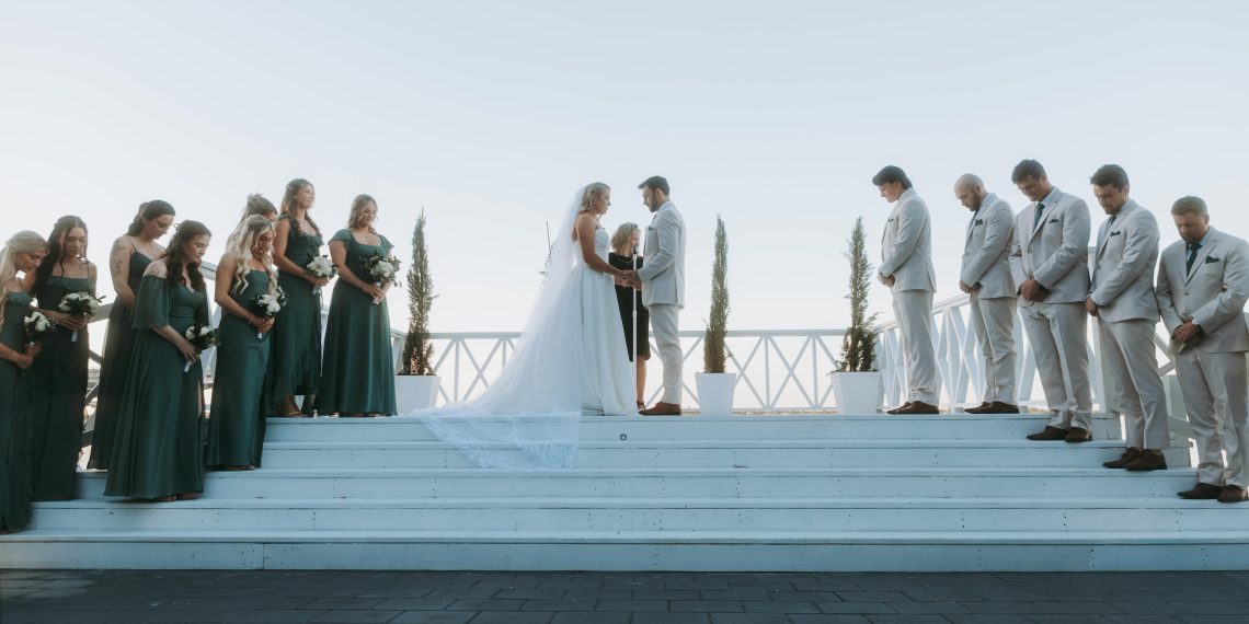 Photo by Alex O'Neal: https://www.pexels.com/photo/elegant-outdoor-wedding-ceremony-with-bridal-party-35349357/