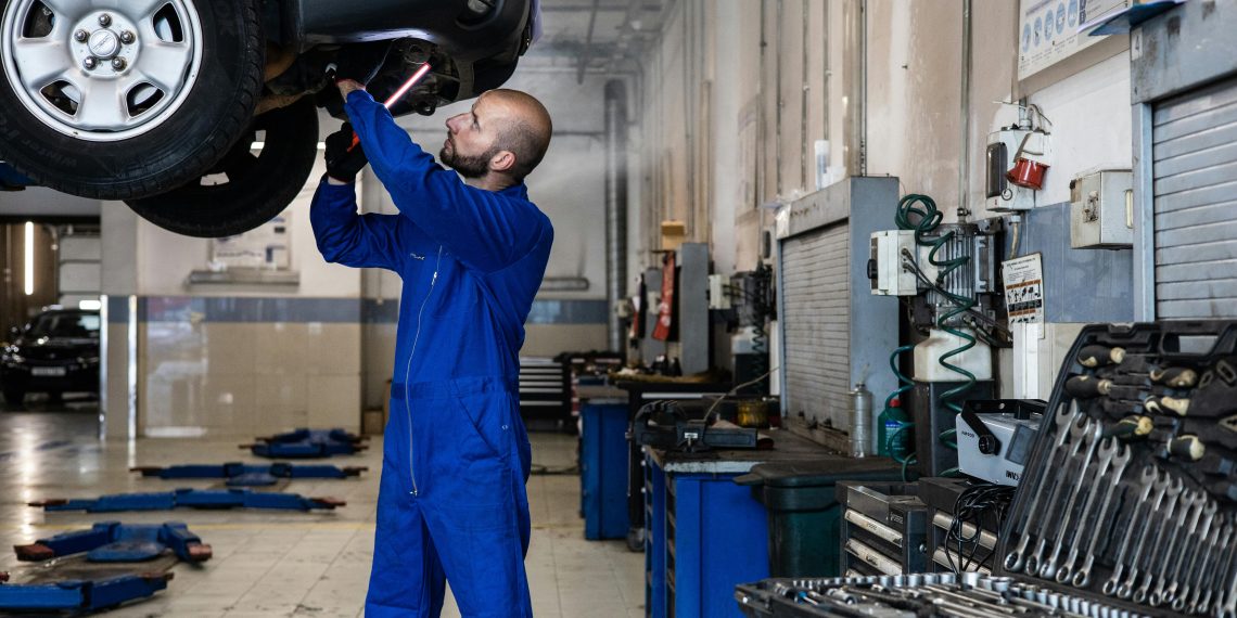 Photo by Artem Podrez: https://www.pexels.com/photo/a-man-in-blue-suit-checking-a-car-8986148/