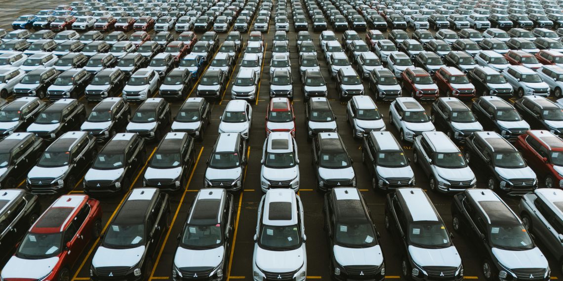 Photo by Luke Miller: https://www.pexels.com/photo/aerial-view-of-vehicle-storage-lot-with-cars-29566897/