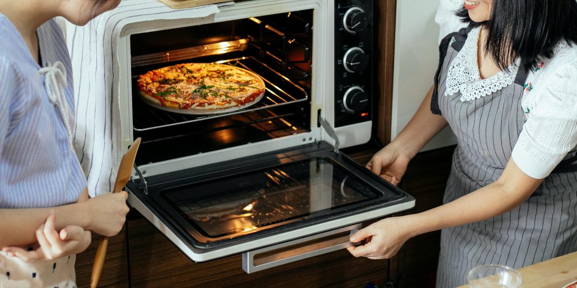 Photo by Katerina Holmes: https://www.pexels.com/photo/crop-women-putting-pizza-in-oven-5908219/