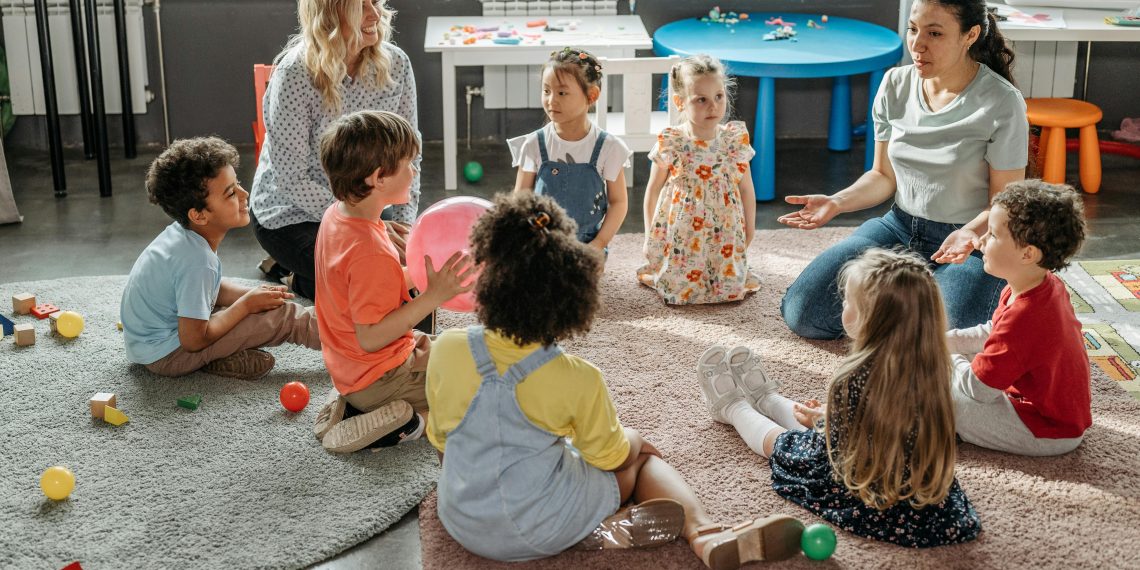 Photo by Pavel Danilyuk: https://www.pexels.com/photo/kids-with-their-teacher-sitting-on-the-floor-8422248/