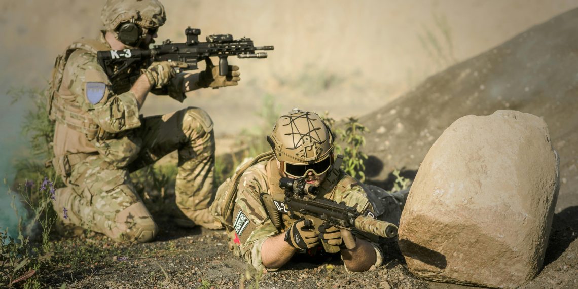 Photo by Pixabay: https://www.pexels.com/photo/military-sniping-near-rock-163467/
