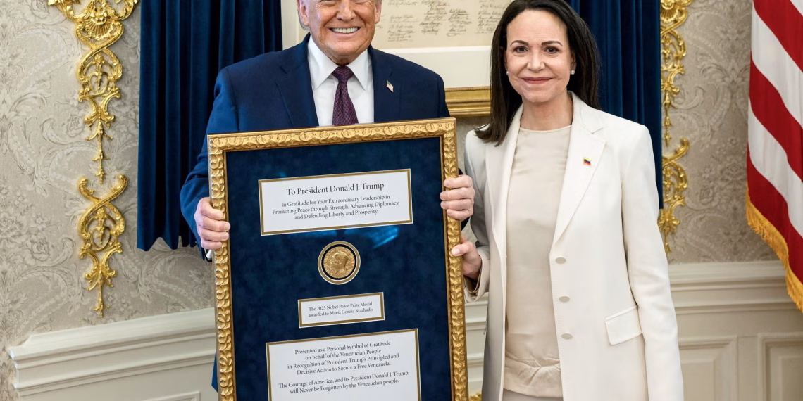 Donald Trump with the Venezuelan opposition leader María Corina Machado, who presented him with her Nobel peace prize medal. Photograph: Daniel Torok/The White House/Reuters