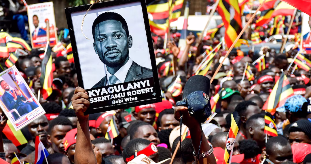 Supporters of Ugandan Presidential candidate Robert Kyagulanyi, also known as Bobi Wine, of the National Unity Platform (NUP) party, attend his campaign caravan ahead of the general elections in Kampala, Uganda December 15, 2025. REUTERS/Abubaker Lubowa/File Photo