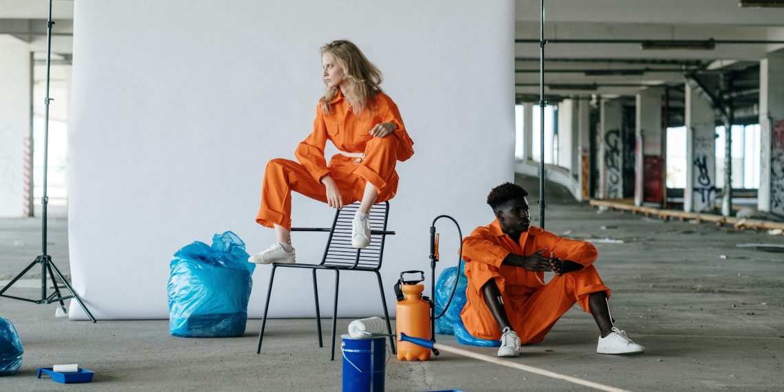 Photo by cottonbro studio: https://www.pexels.com/photo/man-and-woman-in-orange-coveralls-9222420/