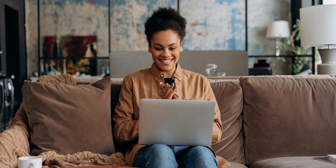 Photo by Mikhail Nilov: https://www.pexels.com/photo/woman-smiling-while-using-her-laptop-6893801/