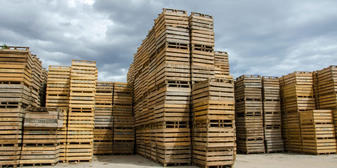 Photo by Victor  Moragriega: https://www.pexels.com/photo/stack-of-wooden-crates-under-cloudy-sky-28775031/